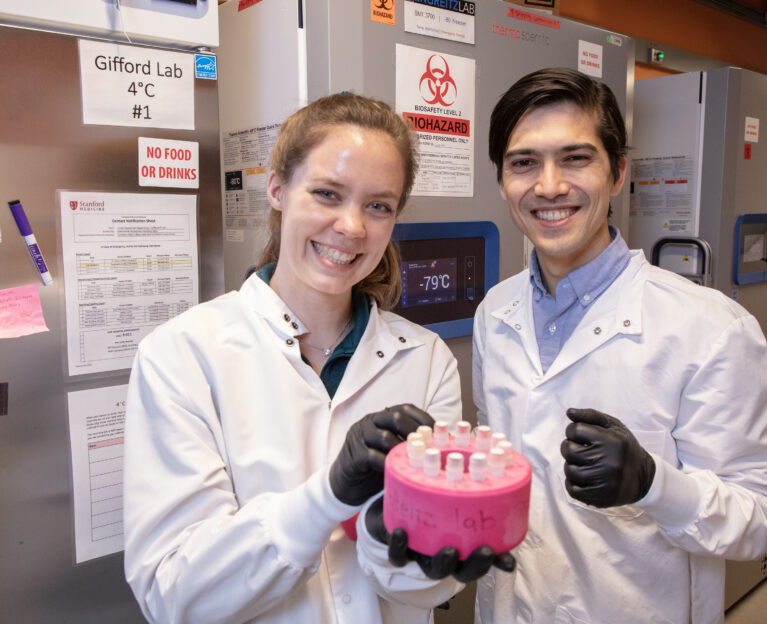 Two researchers holding samples in a heart lab