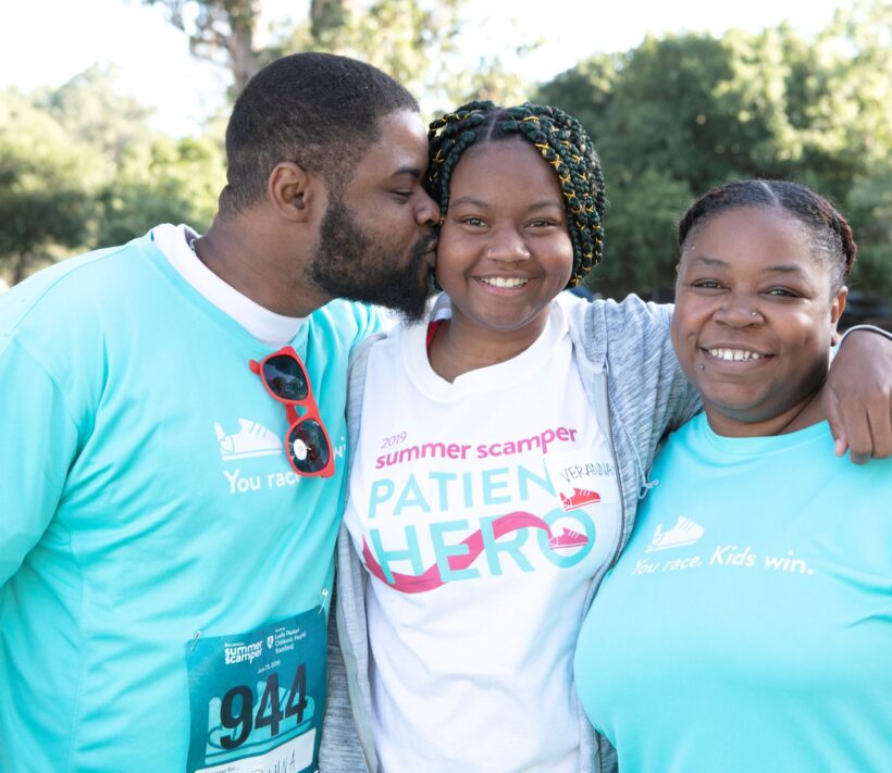 A 17-year old transplant patient with her parents at Summer Scamper