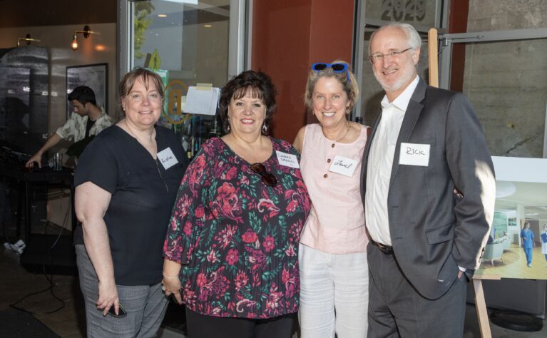 Donor Laurel Lagenaur posing with friends at an event