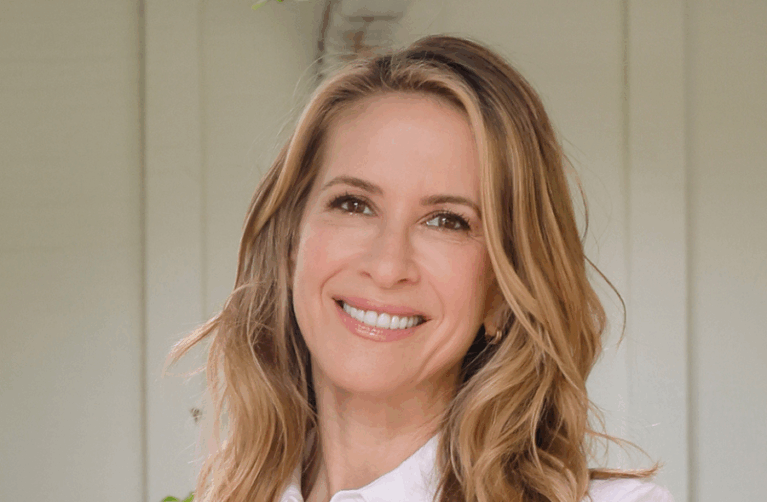 Woman smiling at the camera.