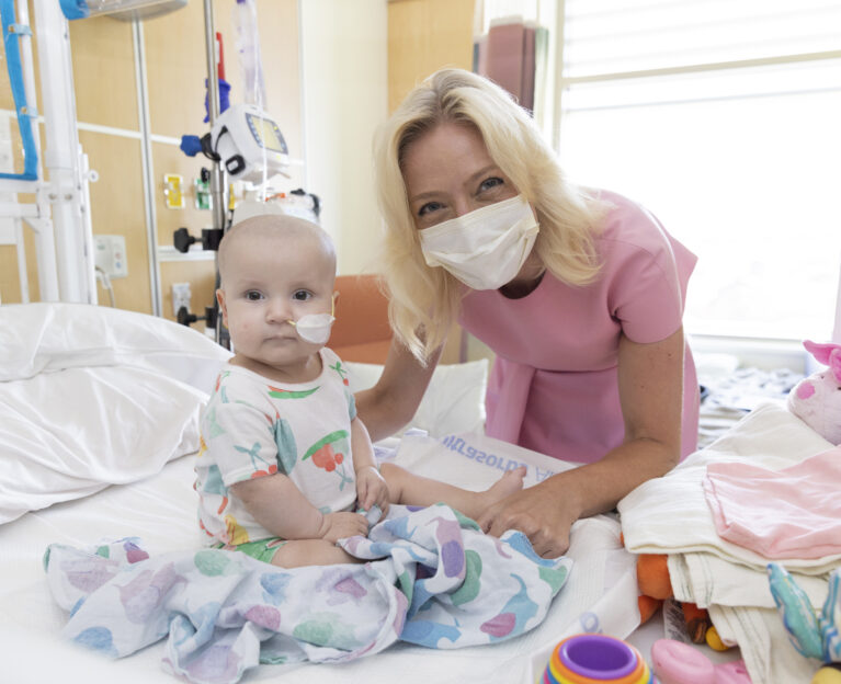 Dr Tanya Gruber with 10 month old stem cell patient Penelope