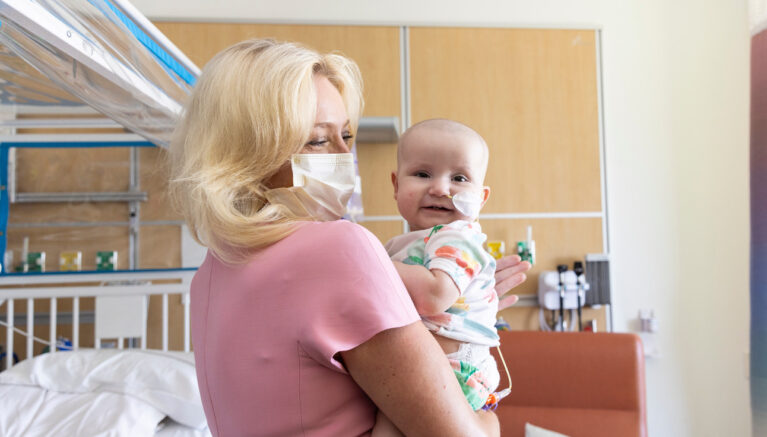 Dr Tanya Gruber holds a young patient