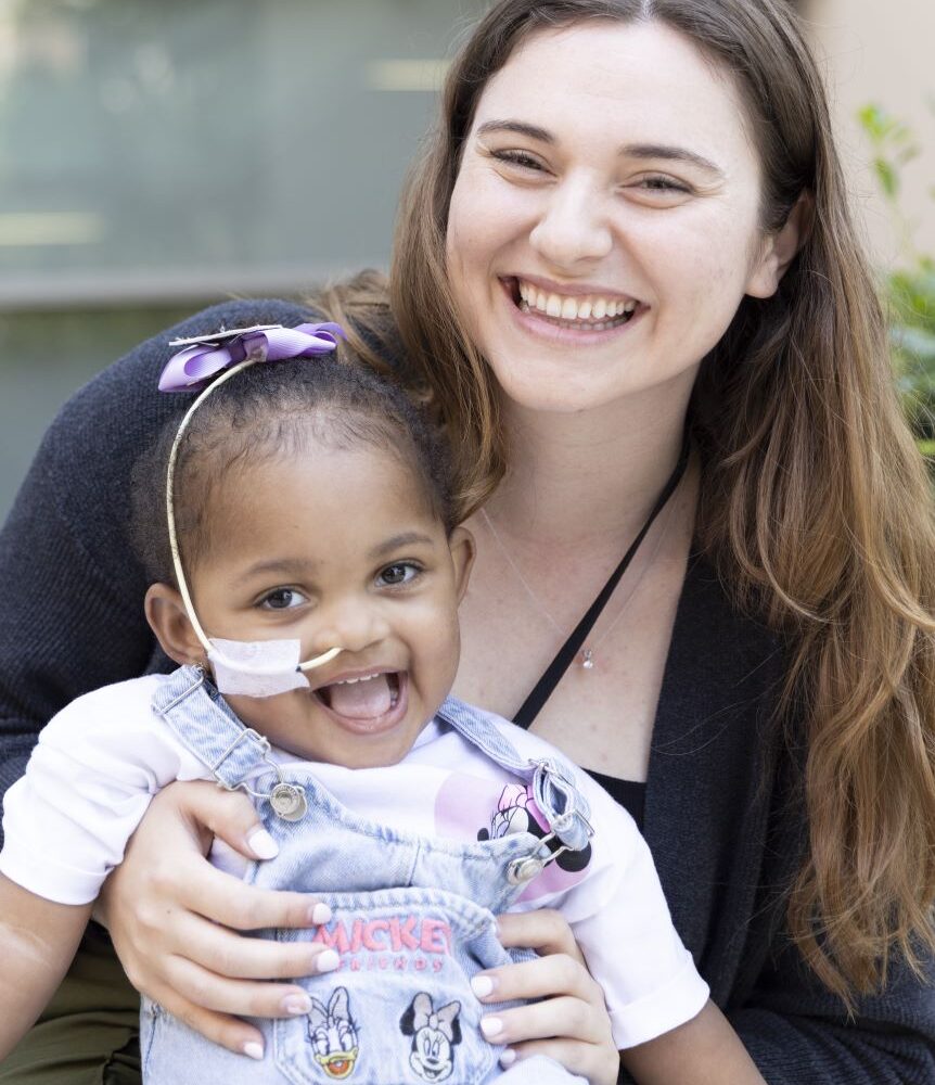 Two-year-old heart patient with her social worker