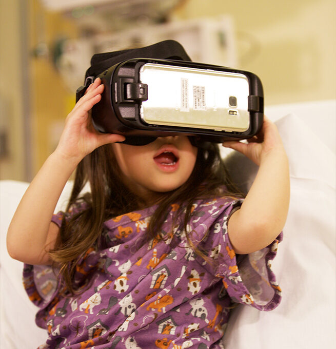 A young patient wears a VR head set 