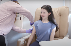Young allergy patient gets a shot of omalizumab