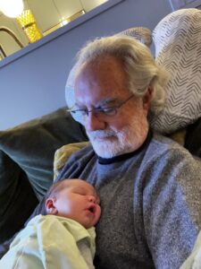 Grandfather holding his infant grandson.