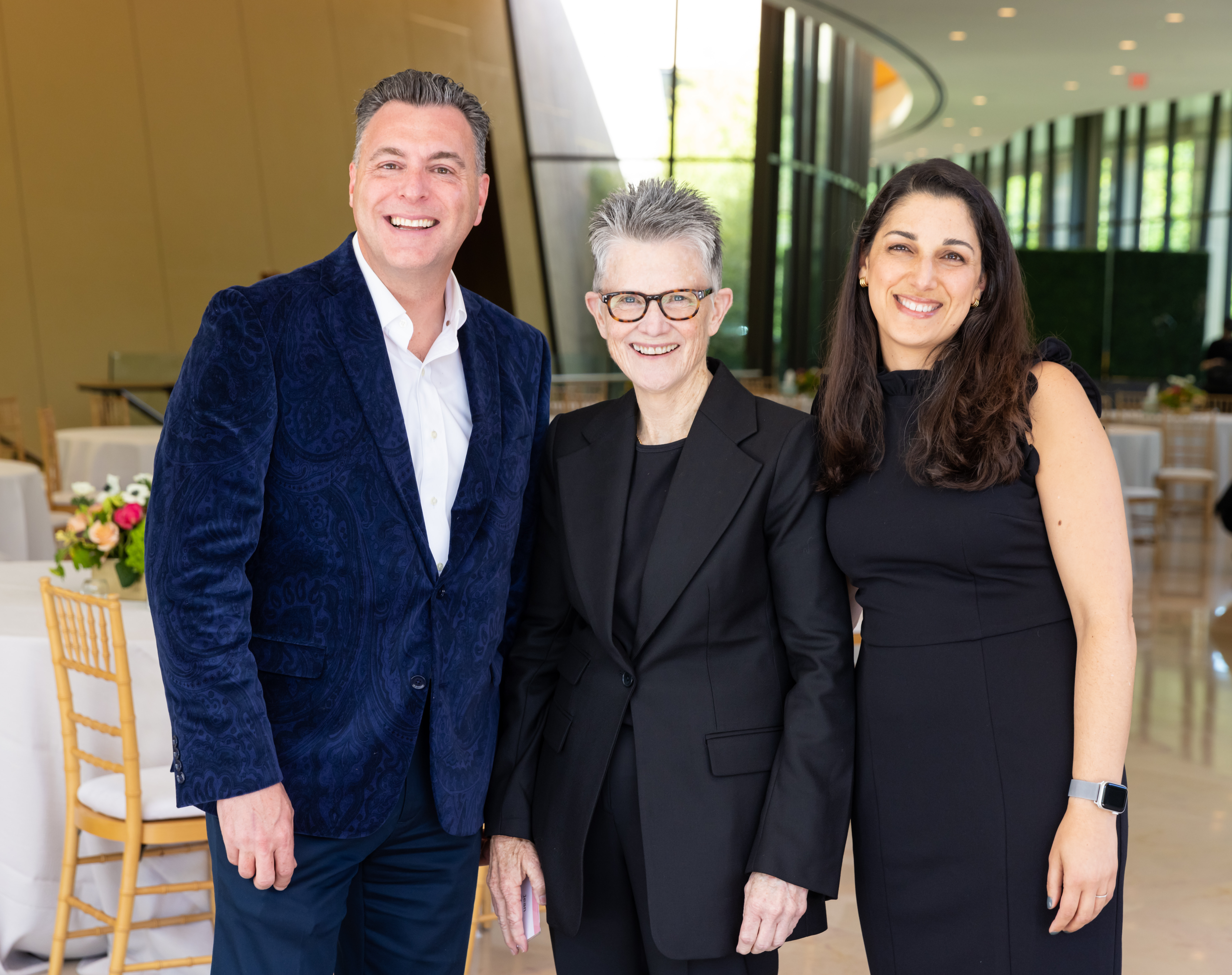 Three members of the gift planning team pose together at an event