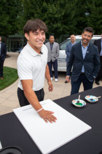 Patient Tyler during the Hyundai Hope on Wheels Handprint Ceremony