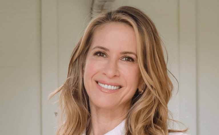 Woman smiling at the camera.