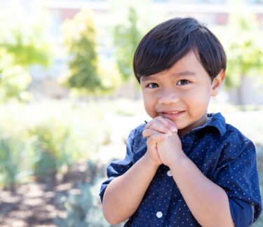 A young boy smiling