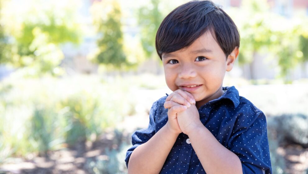 A young boy smiling