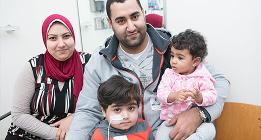 Patient and their family posing for picture.
