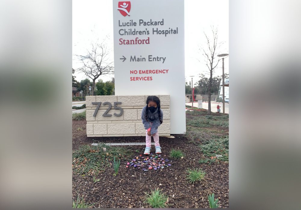 Cece standing in front of Lucile Packard Childrens Hospital sign.