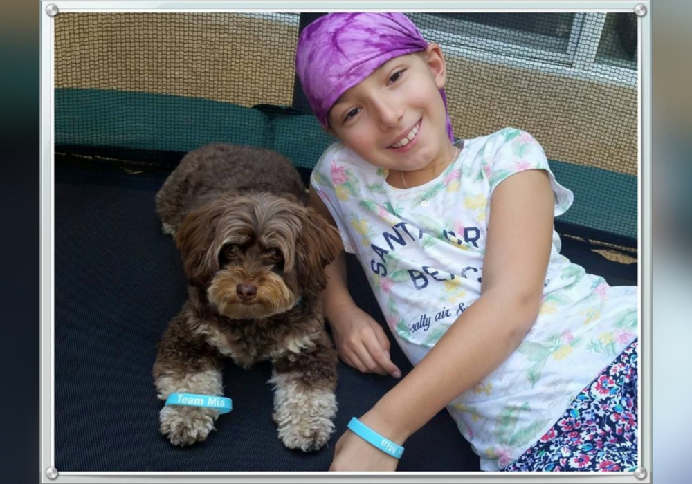 Mia and her dog posed for camera.
