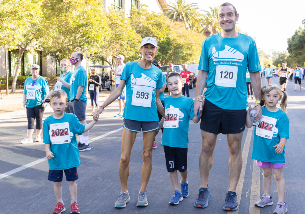 Family posed after participating in Summer Scamper