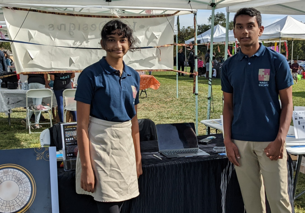 Two students posed at booth.