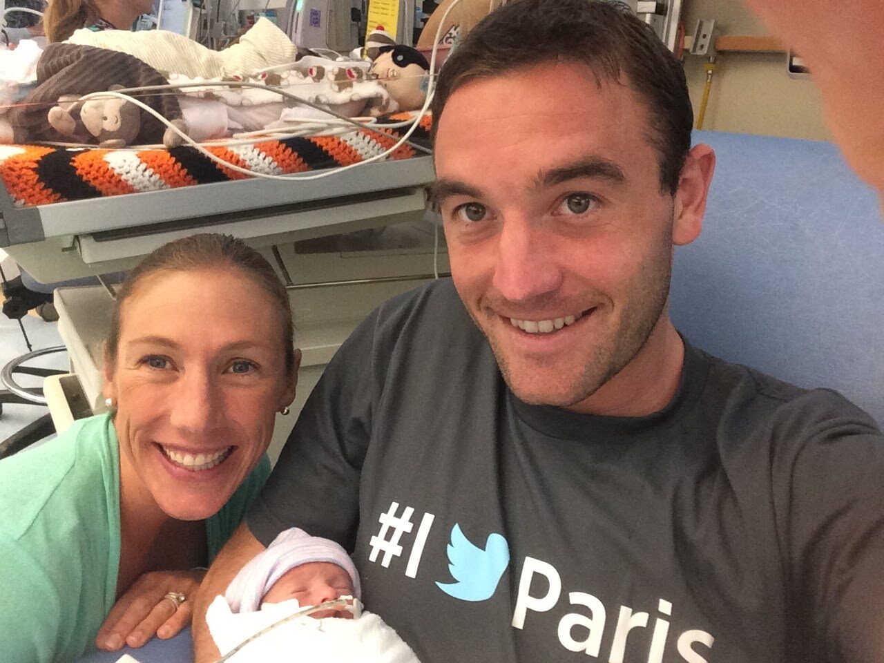 Elizabeth and Kevin holding newborn in NICU