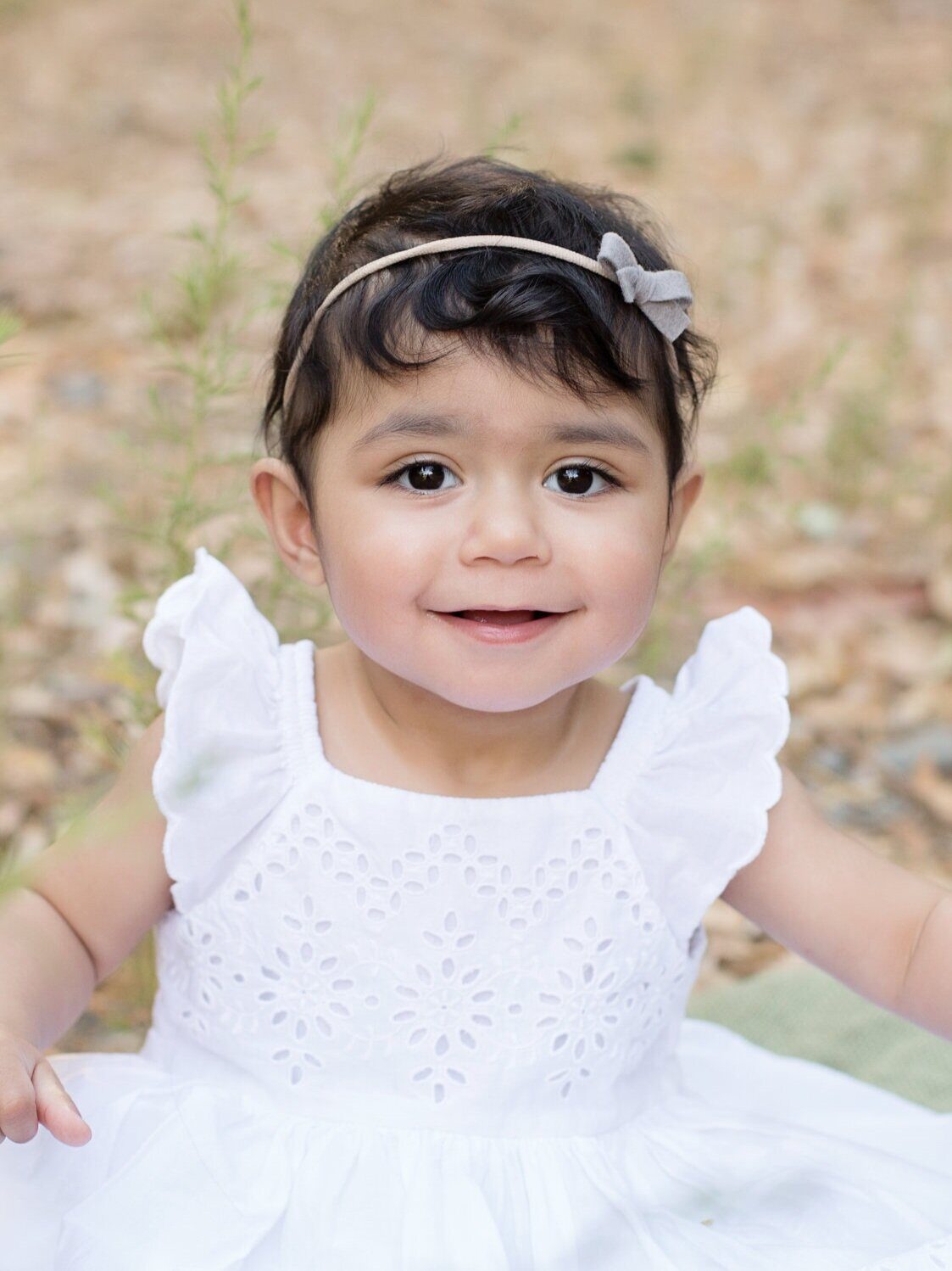 Baby smiling at camera.