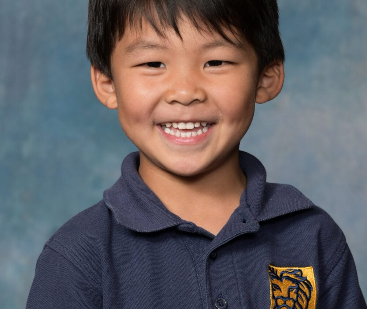 Child smiling at camera.