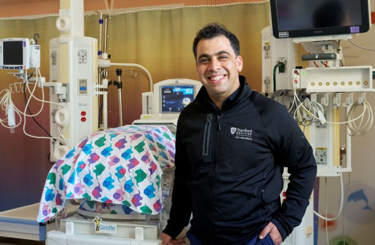 Nima Aghaeepour, PhD in hospital delivery room.