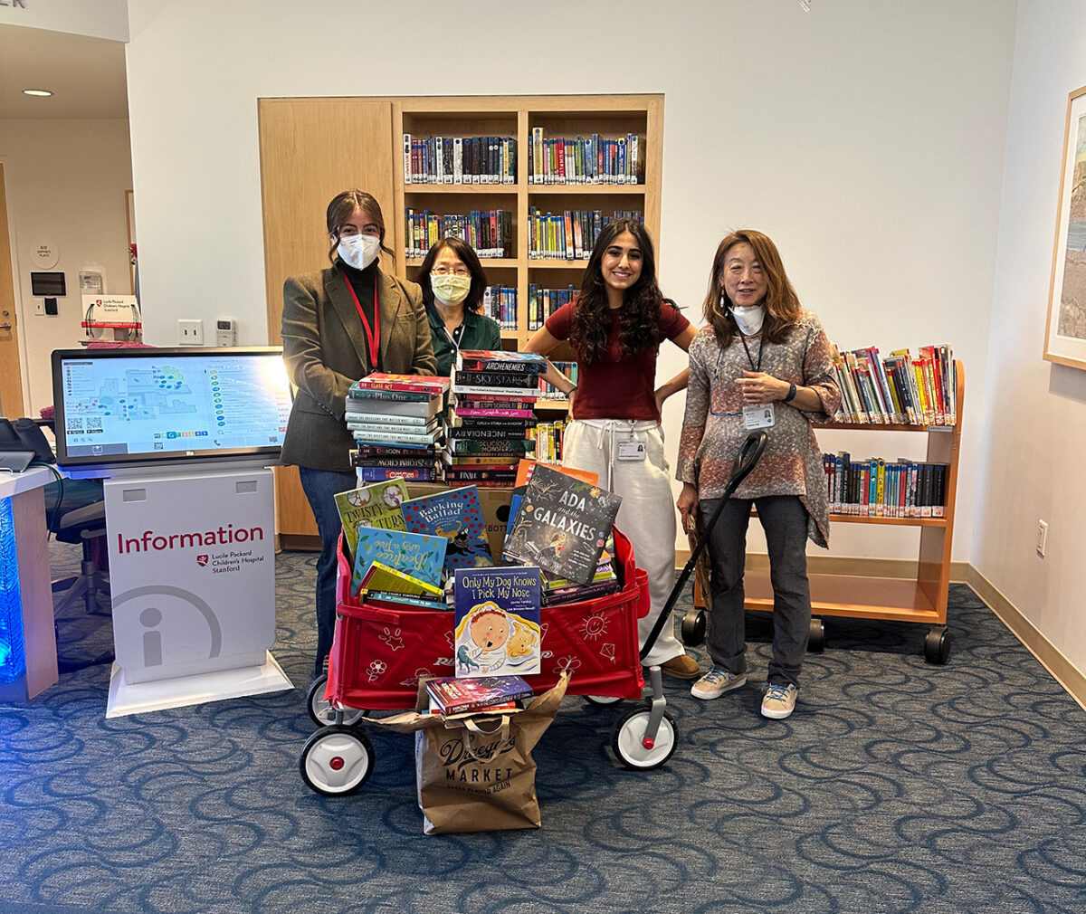 Ariana and friends donating books to Packard Childrens Hospital.