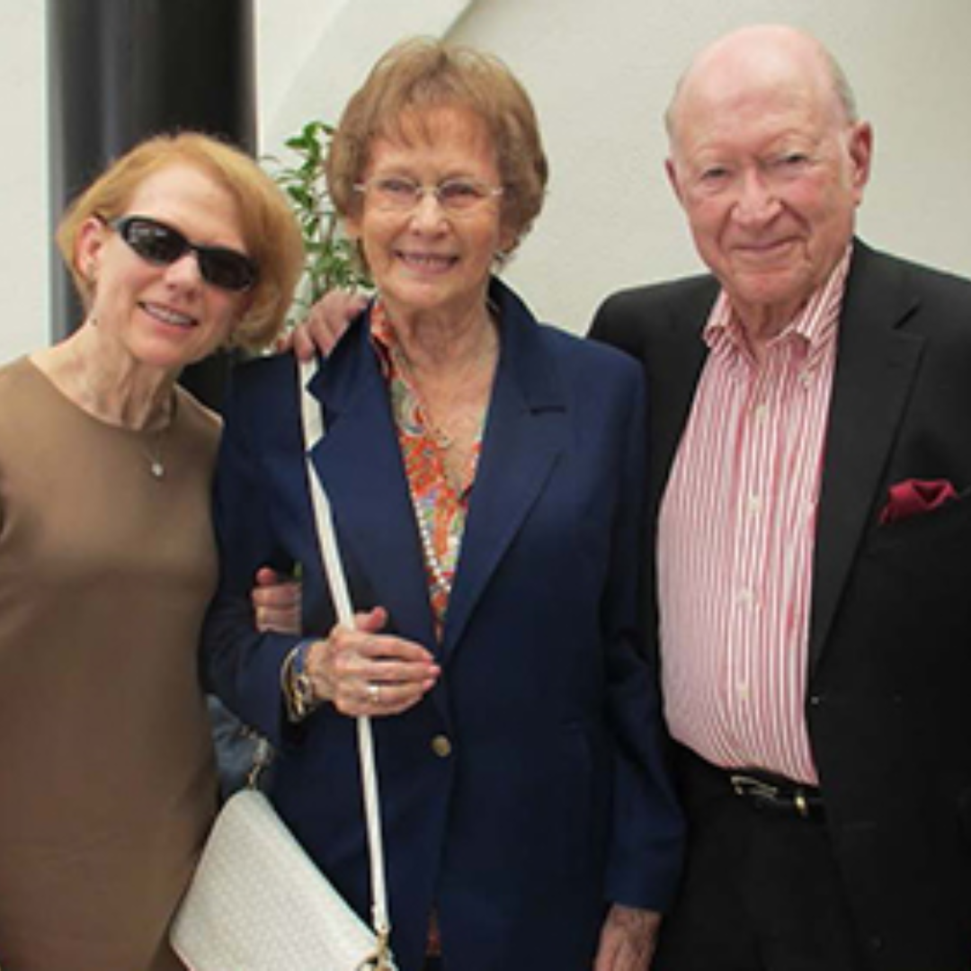 3 donors smiling, dressed in formal wear