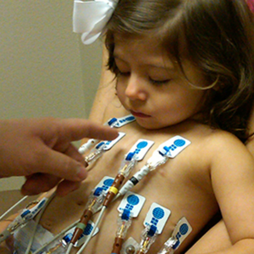 Doctor points to tubes on child's chest