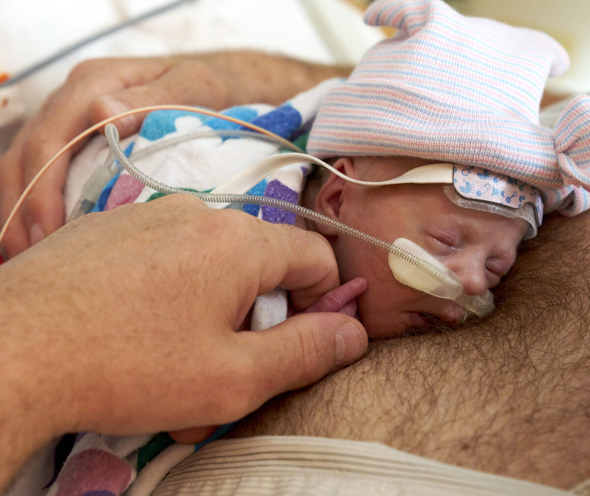 Father holding newborn Austen.