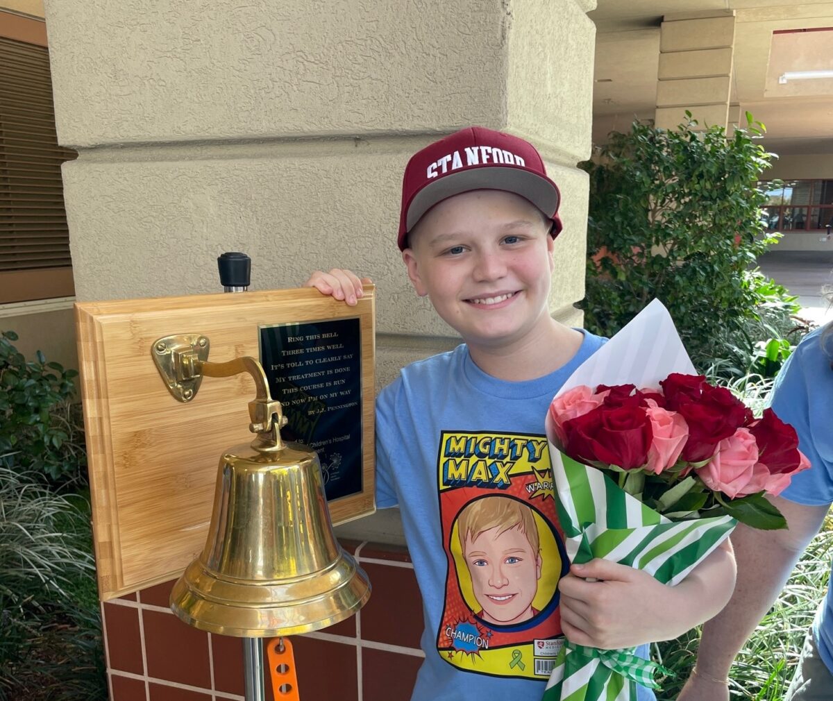 Patient Max posing with a bell.