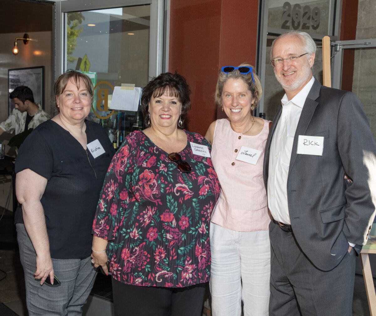 Donor Laurel Lagenaur posing with friends at an event.