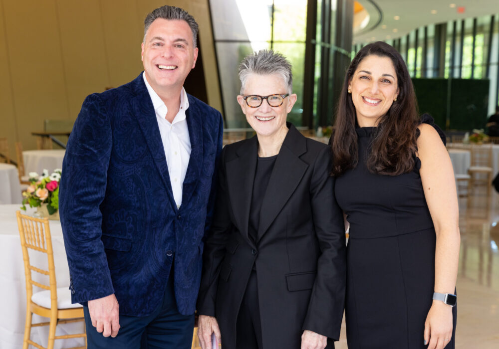 Three members of the gift planning team pose together at an event