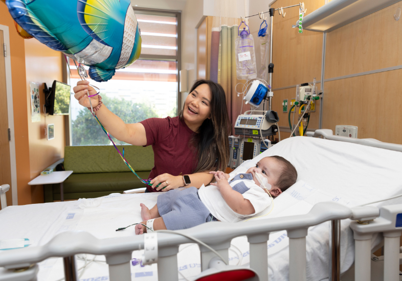Infant patient with their Child Life Specialist.