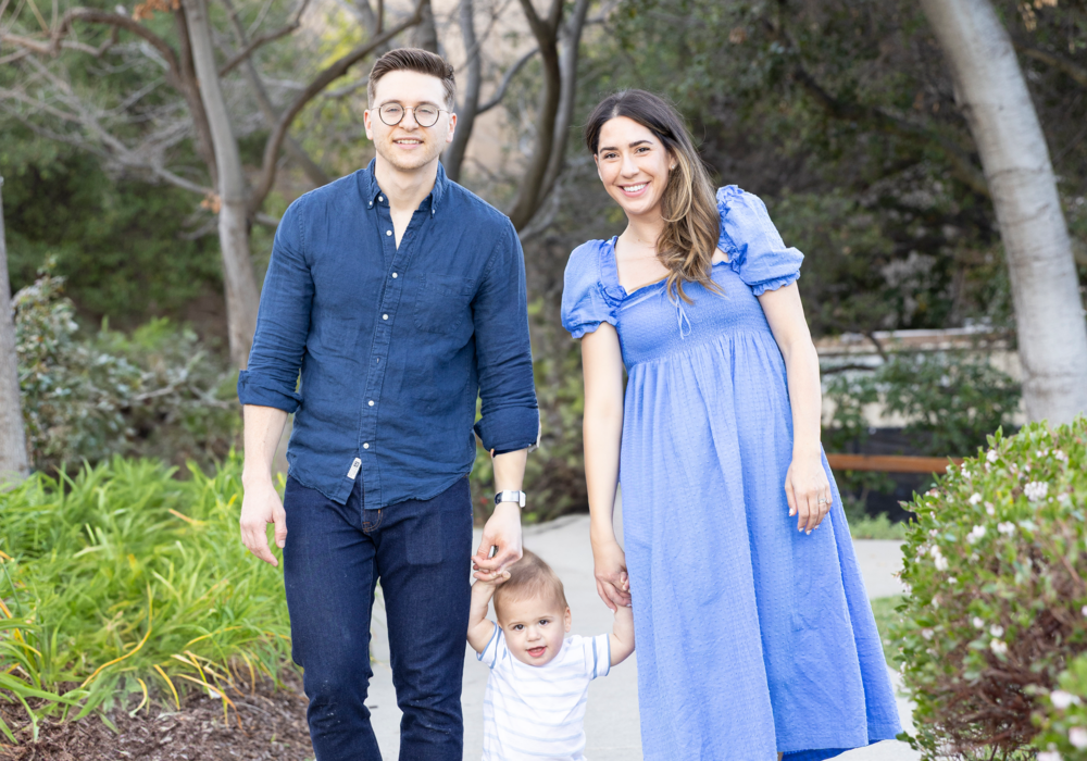 Maddie and her husband David walk hand in hand with their baby at the Stanford Children's Hospital.
