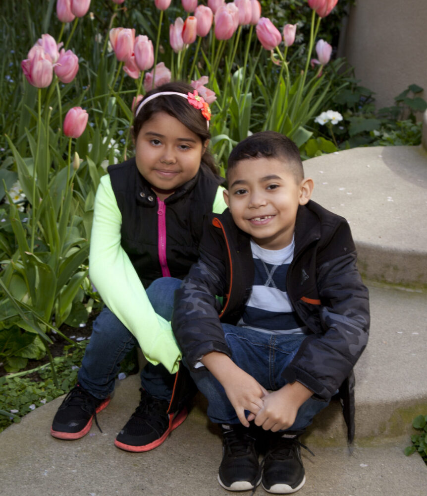 10-year-old Doris Diaz was the 2015 Summer Scamper Patient Hero representing the Pulmonology/Cystic Fibrosis Center. She is photographed with her brother, David Diaz. 
Doris' lifelong battle with cystic fibrosis, which included needing oxygen 24/7, hasn't kept her from becoming a legend in her elementary school in Menlo Park. She is known as "The Lipstick Girl"  —  as she never leaves the house without a layer of her favorite gloss. 
Doris will never forget June 3, 2014, the day she received the call from pulmonologist Carlos Milla, MD: a set of donor lungs became available, only two weeks before her 9th birthday. "I was praying to get a lung transplant before my birthday. When I got the call, I was crying and scared and happy all together," she says. After her double lung transplant, Doris was able to take deep breaths for the first time in her life.