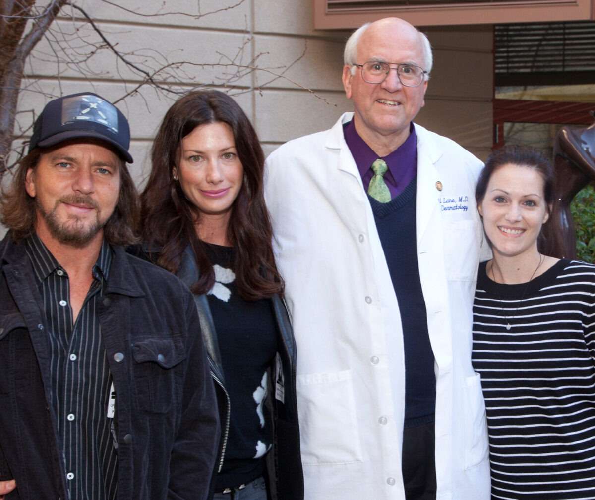 Doctor Lane standing with Eddie Vedder, Jill Vedder, and Heather Fullmer