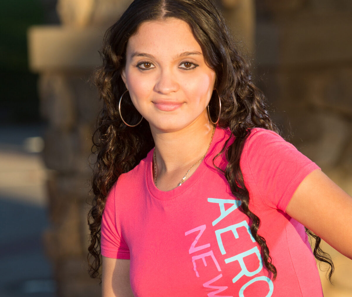 A photo portrait of Karina taken outside.