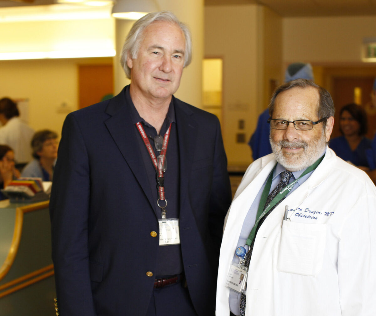 Dr Maurice Druzin poses with Johnson Center director David Stevenson, MD at an event.