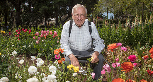 Elderly adult smiling at camera.