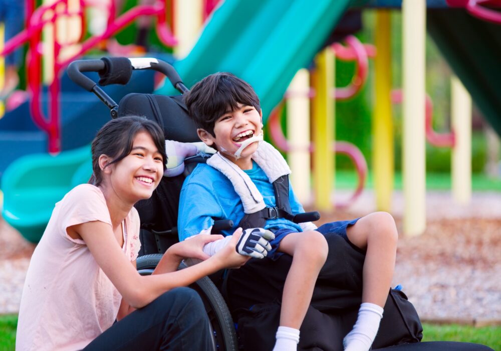 Boy in a wheelchair at a playground