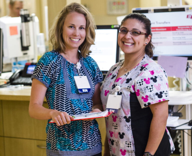 Two nurses smiling to camera