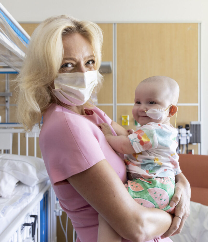 Dr Tanja Gruber holding a young patient
